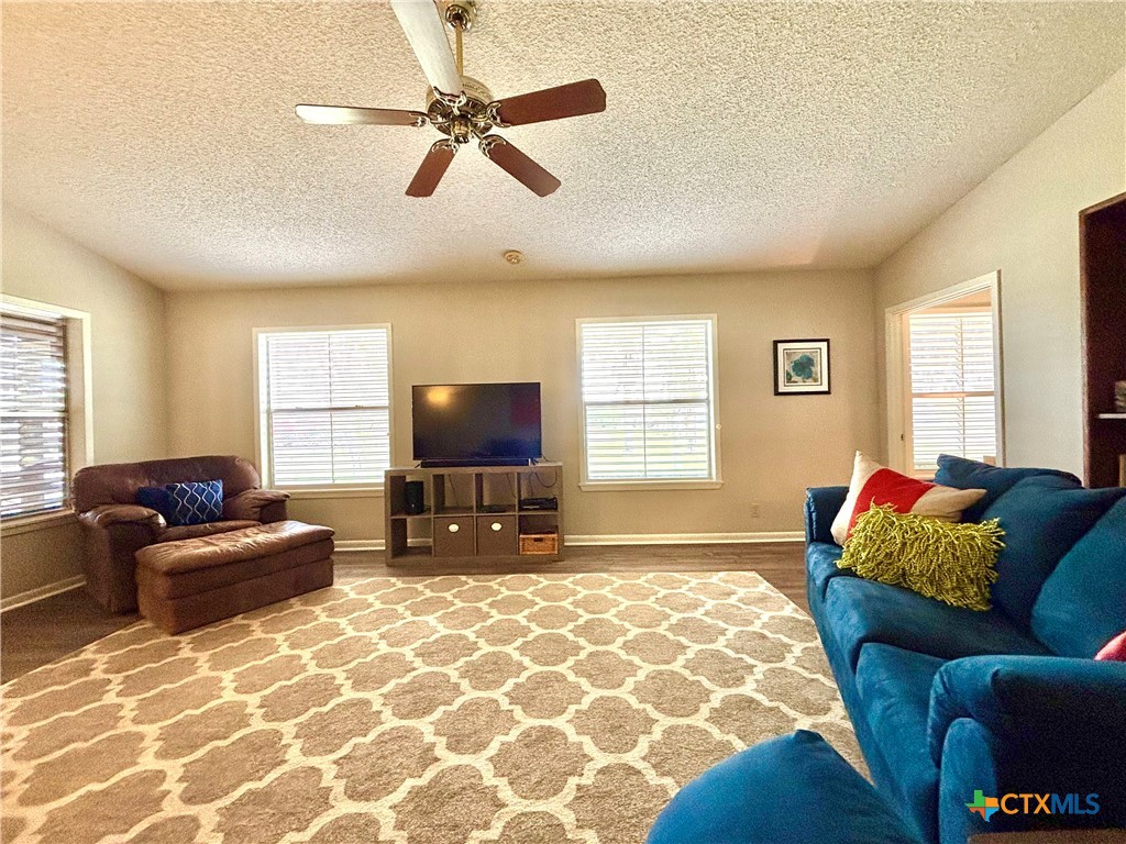 503 16th Street Port O'Connor, TX 77982 - Photo 14 of 48 a living room with furniture and a flat screen tv