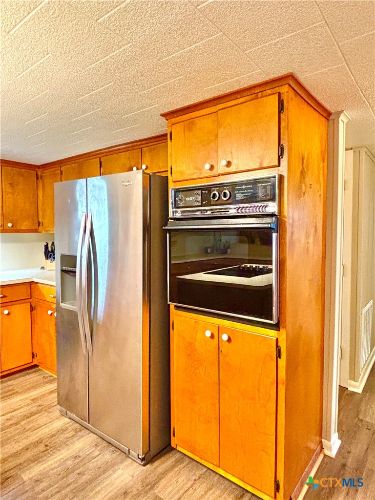 503 16th Street Port O'Connor, TX 77982 - Photo 21 of 48 a view of a kitchen with a refrigerator and a stove