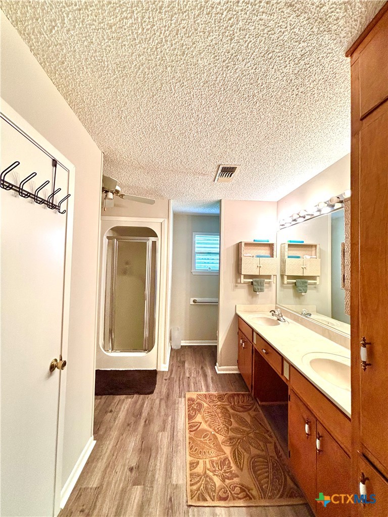 503 16th Street Port O'Connor, TX 77982 - Photo 27 of 48 a bathroom with a granite countertop sink and a mirror