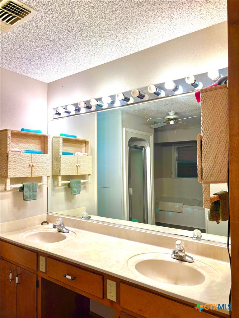 503 16th Street Port O'Connor, TX 77982 - Photo 28 of 48 a bathroom with a sink double vanity and a mirror
