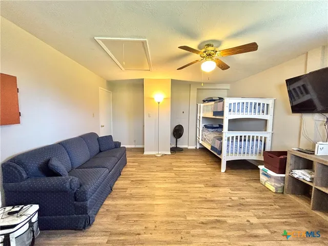 a view of living room kitchen and hall with wooden floor