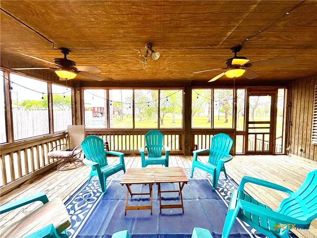 a view of a livingroom with wooden floor and a window