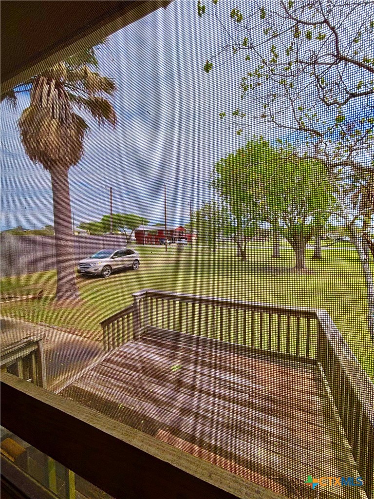 503 16th Street Port O'Connor, TX 77982 - Photo 9 of 48 a view of a balcony with two chairs