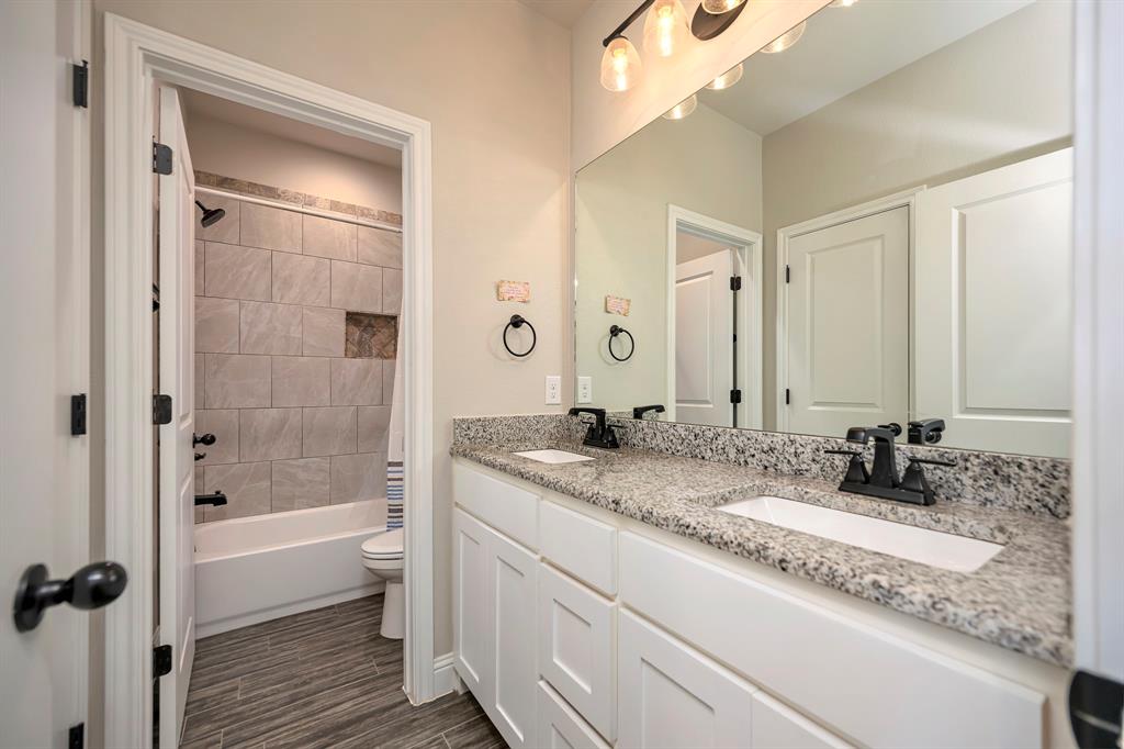 917 East 3rd Street Springtown, TX 76082 - Photo 25 of 32 Full Bath 2 with double sinks and granite counters.