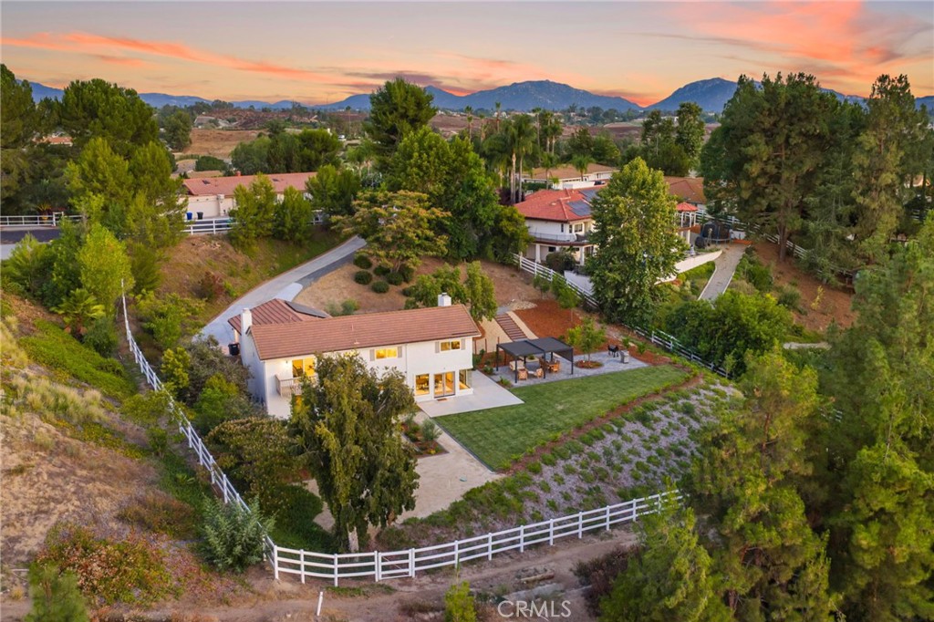 an aerial view of a house with a garden