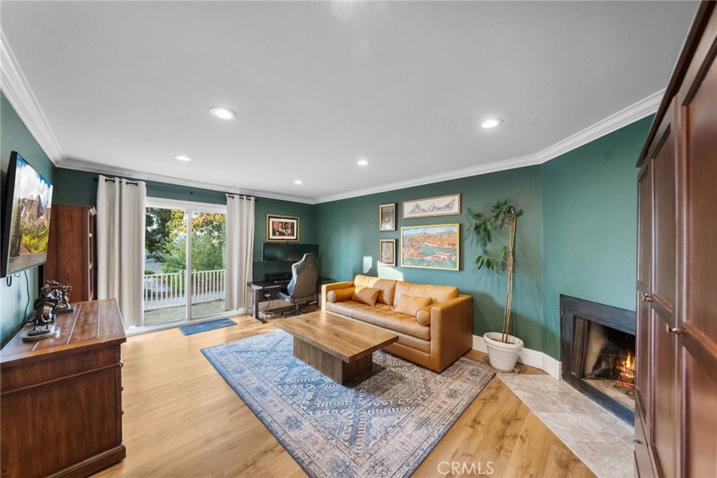 40221 Paseo Sereno Temecula, CA 92591 - Photo 17 of 45 a living room with fireplace furniture and a flat screen tv