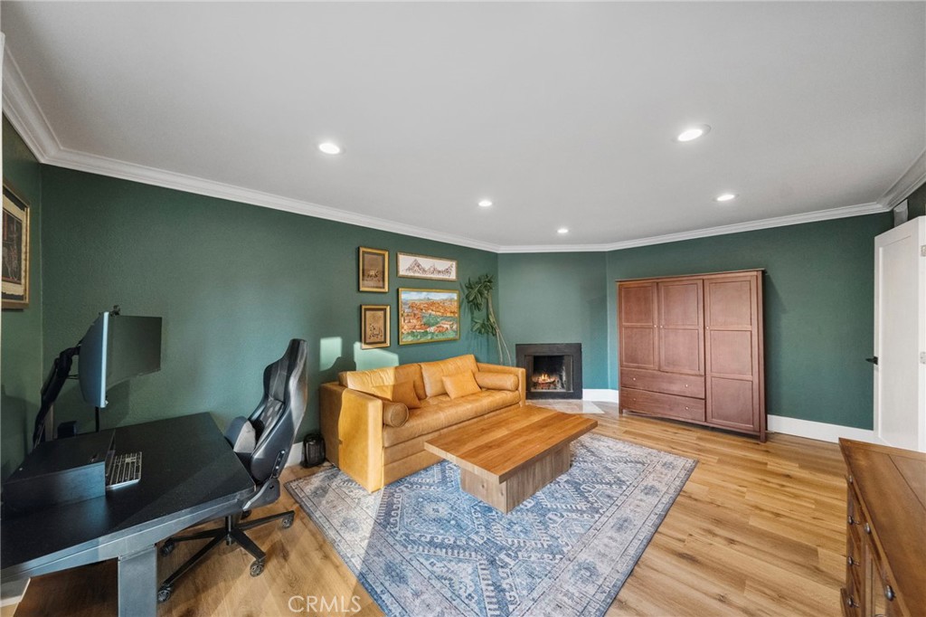 40221 Paseo Sereno Temecula, CA 92591 - Photo 18 of 45 a living room with furniture a wooden floor and a flat screen tv