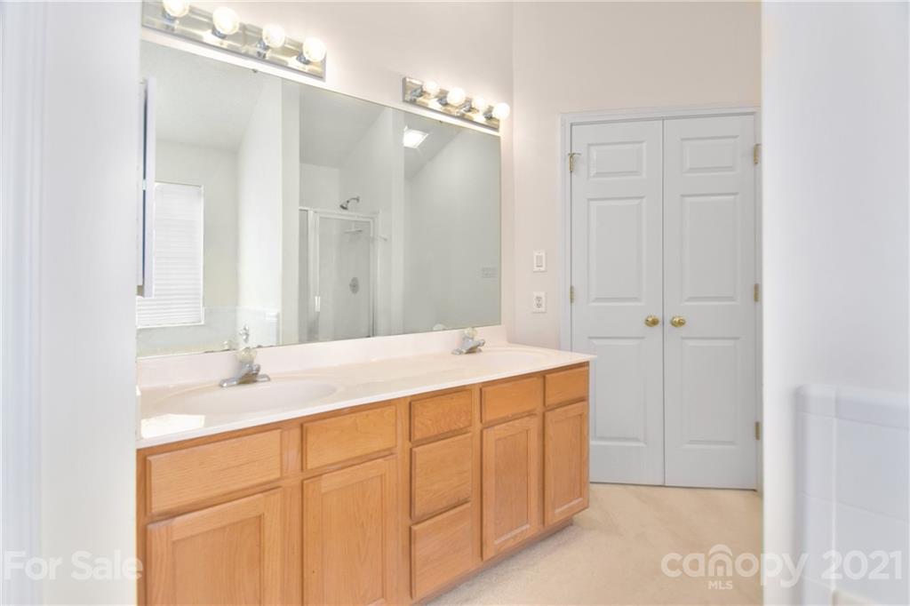 3407 Brownes Ferry Road Charlotte, NC 28269 - Photo 12 of 24 a bathroom with a sink vanity granite and shower