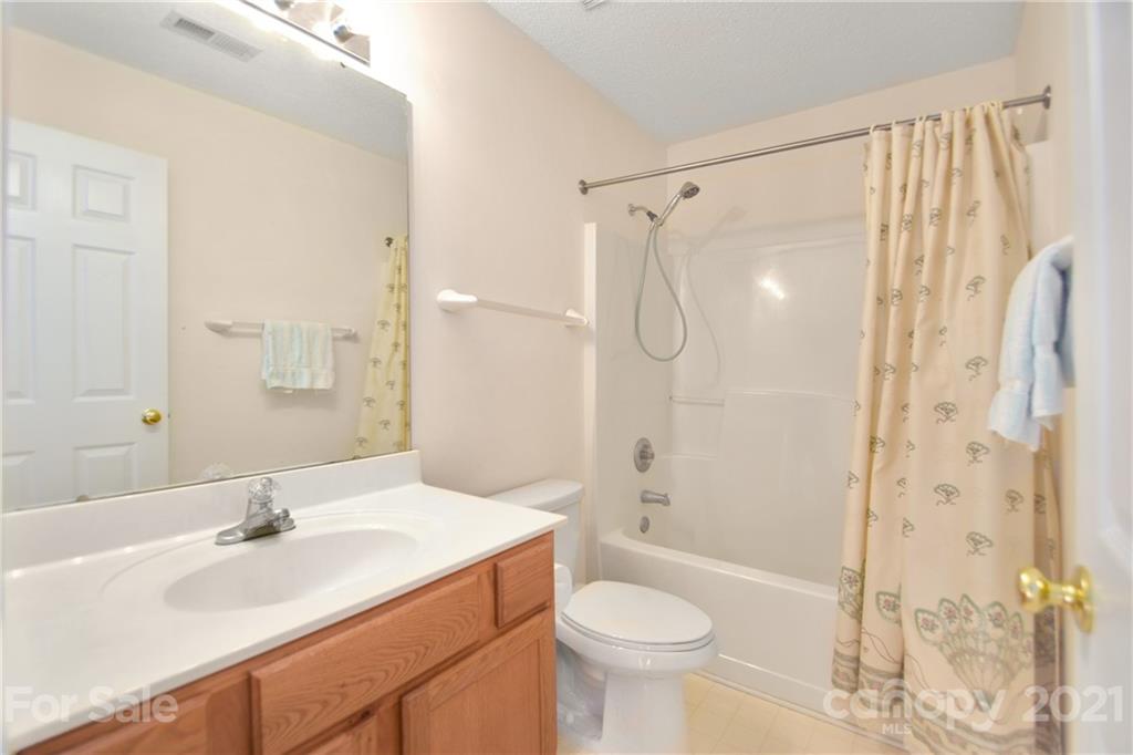 3407 Brownes Ferry Road Charlotte, NC 28269 - Photo 15 of 24 a bathroom with a sink toilet tub and shower