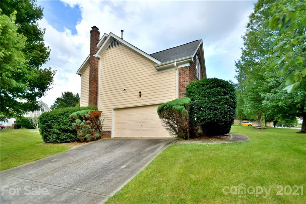 3407 Brownes Ferry Road Charlotte, NC 28269 - Photo 20 of 24 a front view of house with a garden