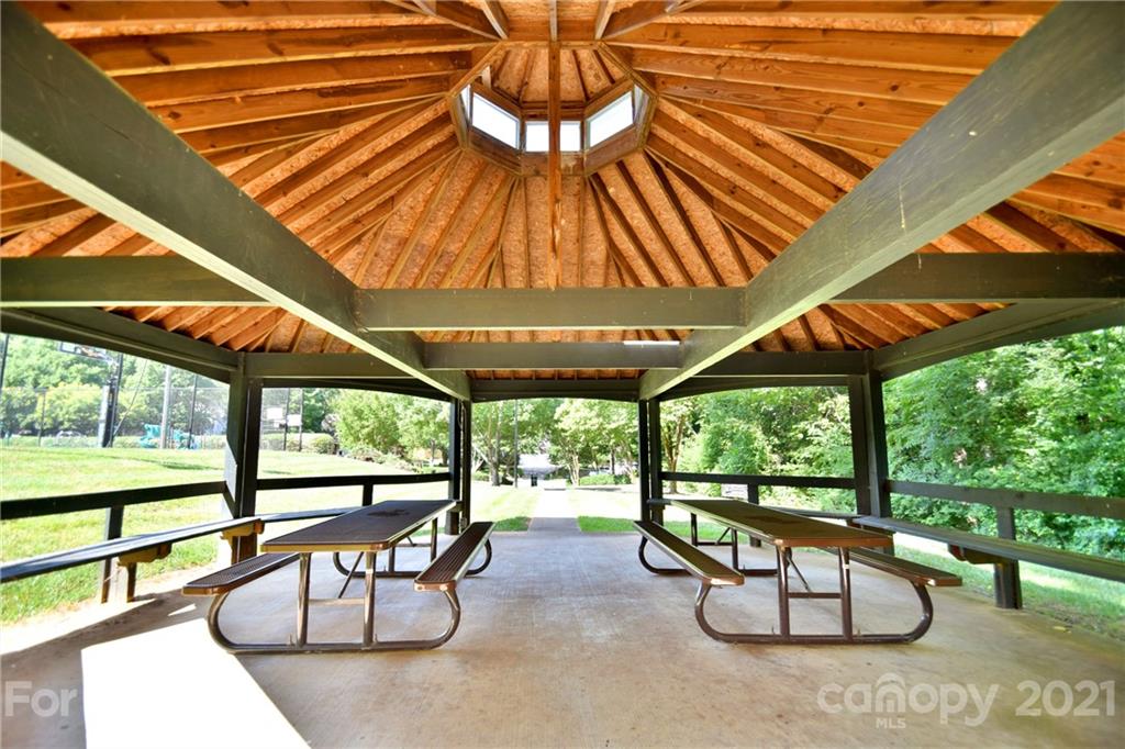 3407 Brownes Ferry Road Charlotte, NC 28269 - Photo 22 of 24 a view of chairs and tables in the patio