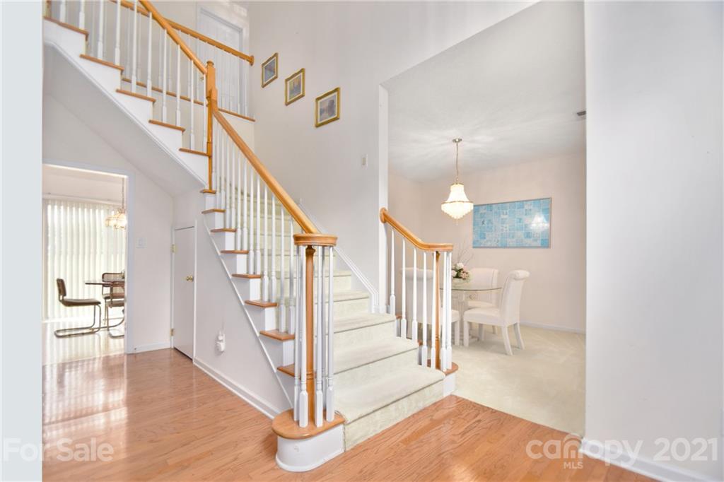 3407 Brownes Ferry Road Charlotte, NC 28269 - Photo 4 of 24 a view of entryway and hall with wooden floor
