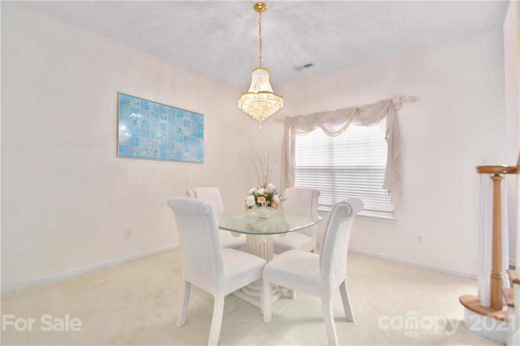 3407 Brownes Ferry Road Charlotte, NC 28269 - Photo 5 of 24 a dining room with furniture and window