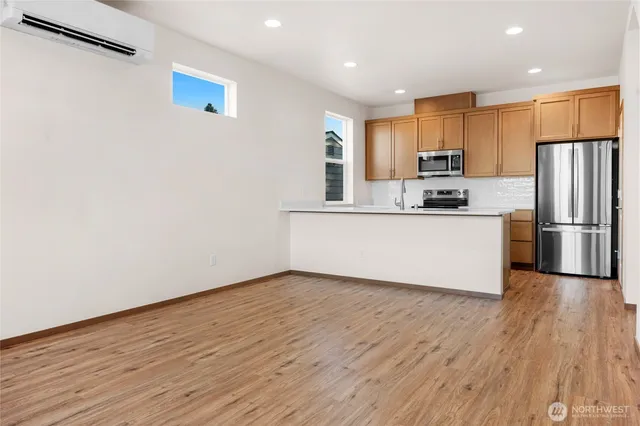 a kitchen with stainless steel appliances a refrigerator and a sink