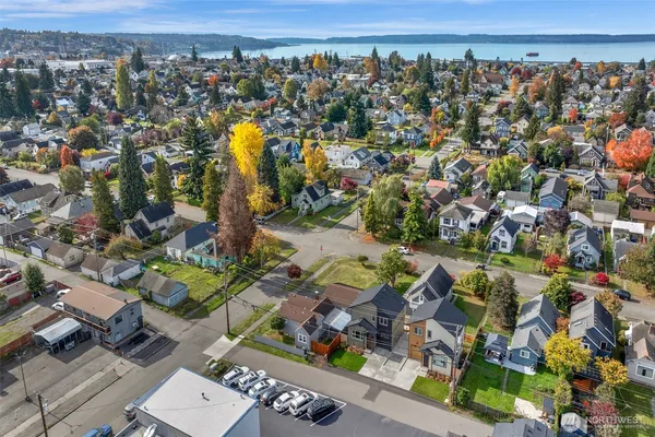 an aerial view of a house with a garden and lake view