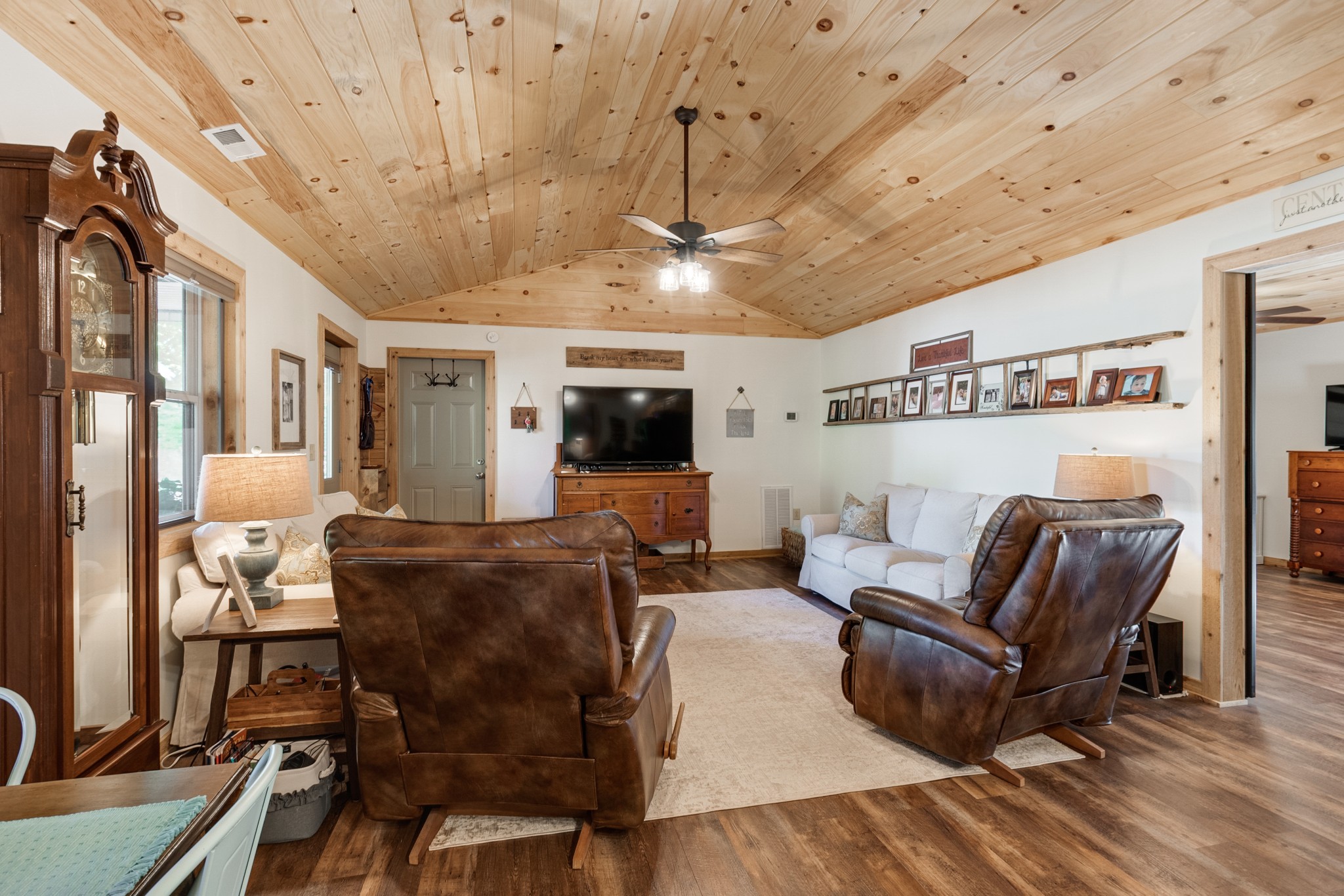 6089 Norman Thomas Road Silver Point, TN 38582 - Photo 11 of 37 a living room with furniture a flat screen tv and a table