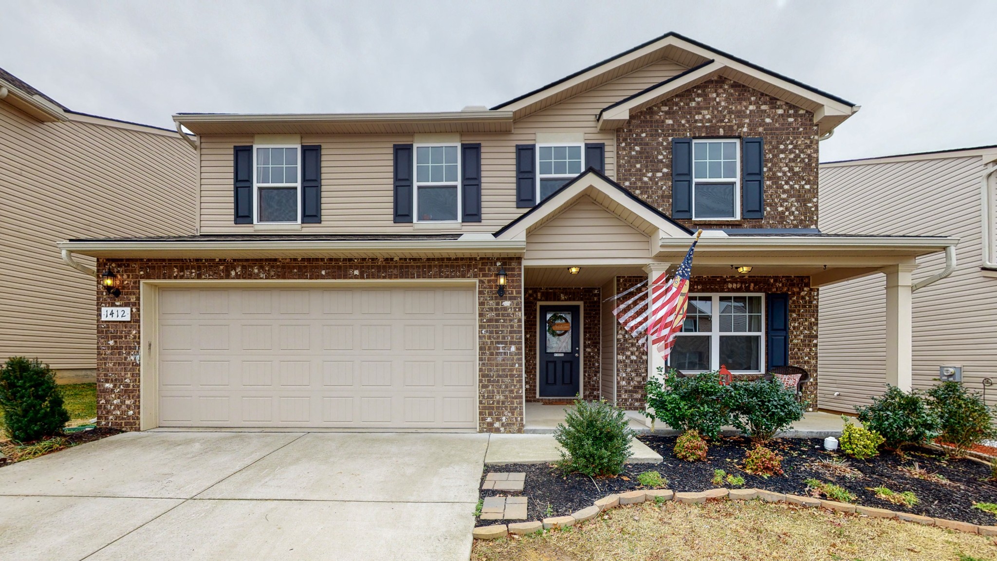 1412 Old Stone Road Lebanon, TN 37087 - Photo 1 of 18 a front view of a house with garden
