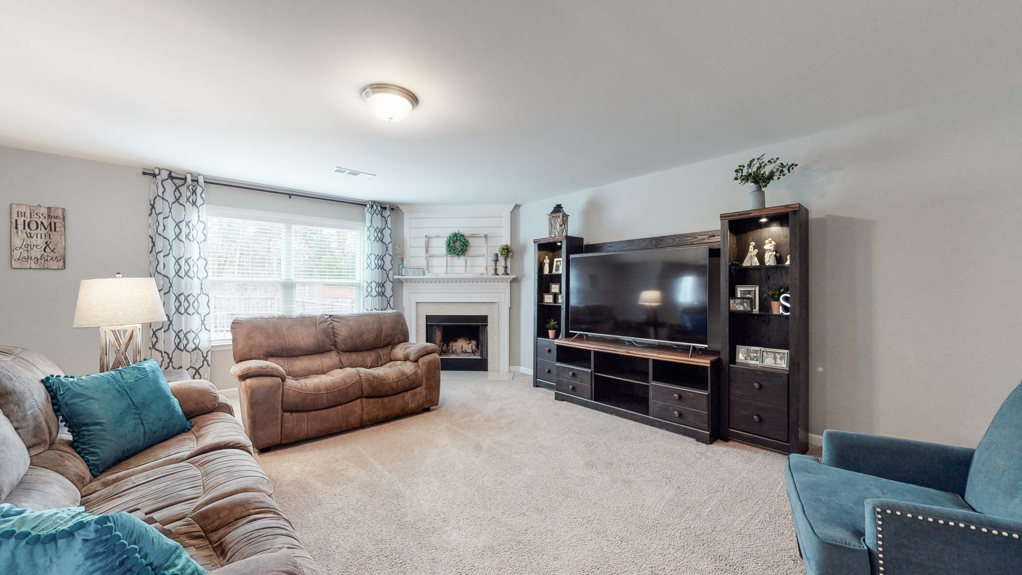 1412 Old Stone Road Lebanon, TN 37087 - Photo 6 of 18 a living room with furniture and a flat screen tv