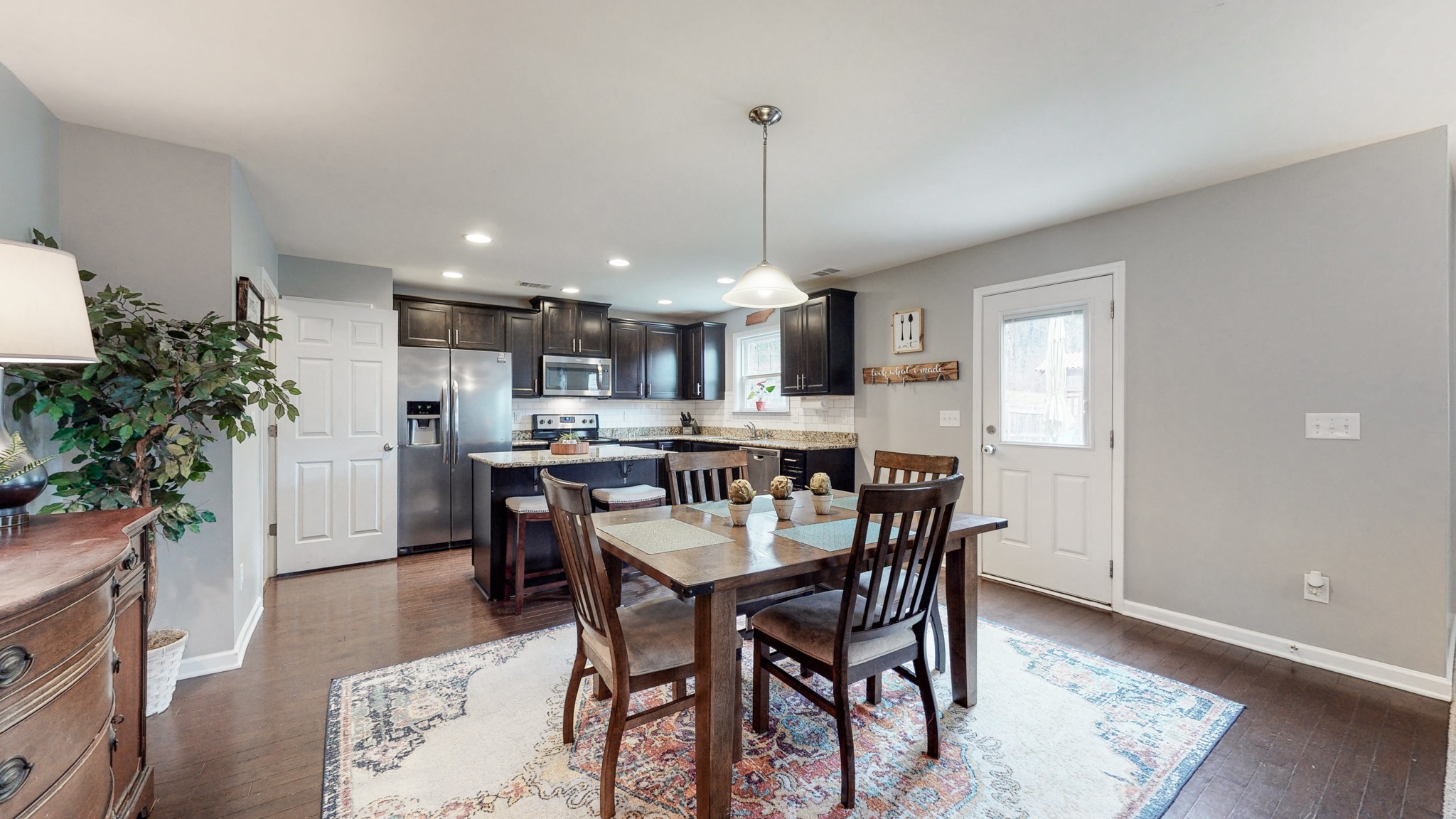 1412 Old Stone Road Lebanon, TN 37087 - Photo 7 of 18 a kitchen with a table and chairs in it