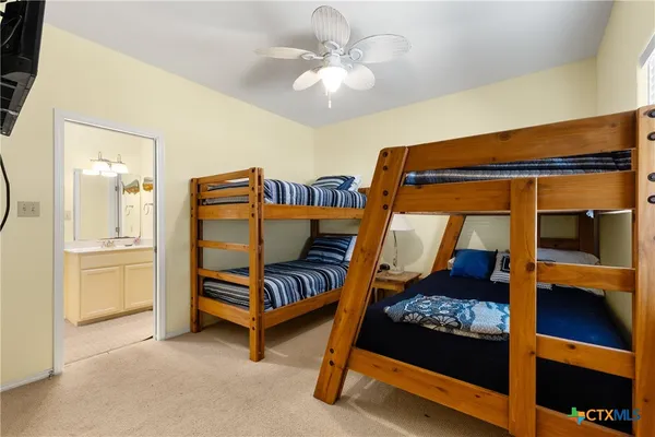 a bedroom with furniture and a chandelier
