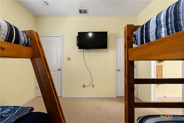 a view of living room with furniture and flat screen tv