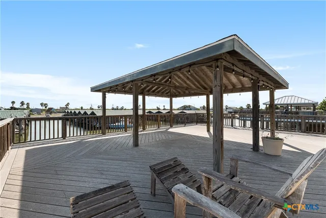a roof deck view with a table and chairs