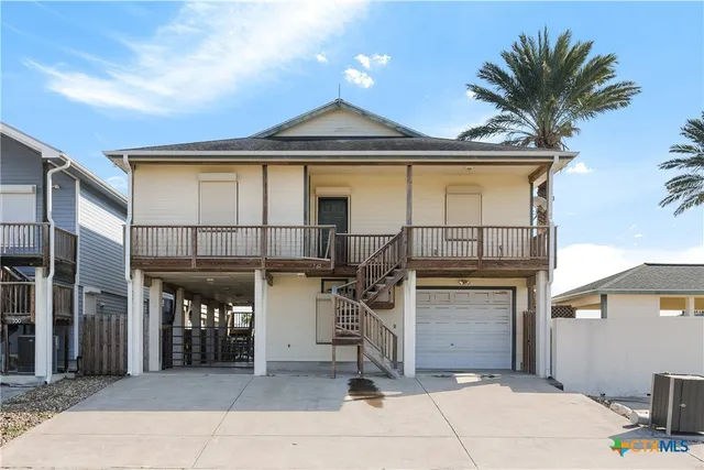 a view of a house with a patio and a sink