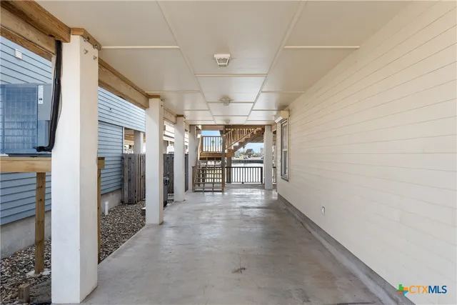 a view of a hallway with seating area