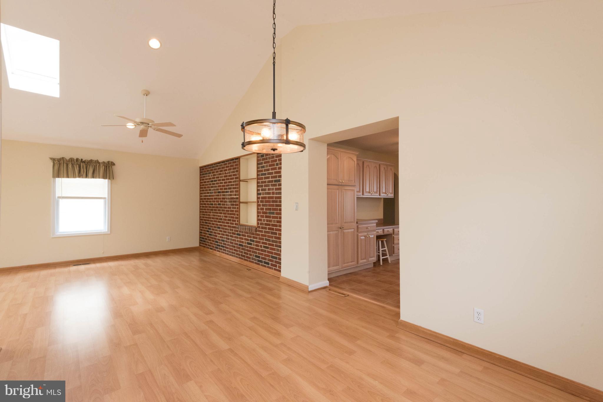 259 Harlem Road Pasadena, MD 21122 - Photo 14 of 30 Vaulted Dining Room with Pergo Flooring