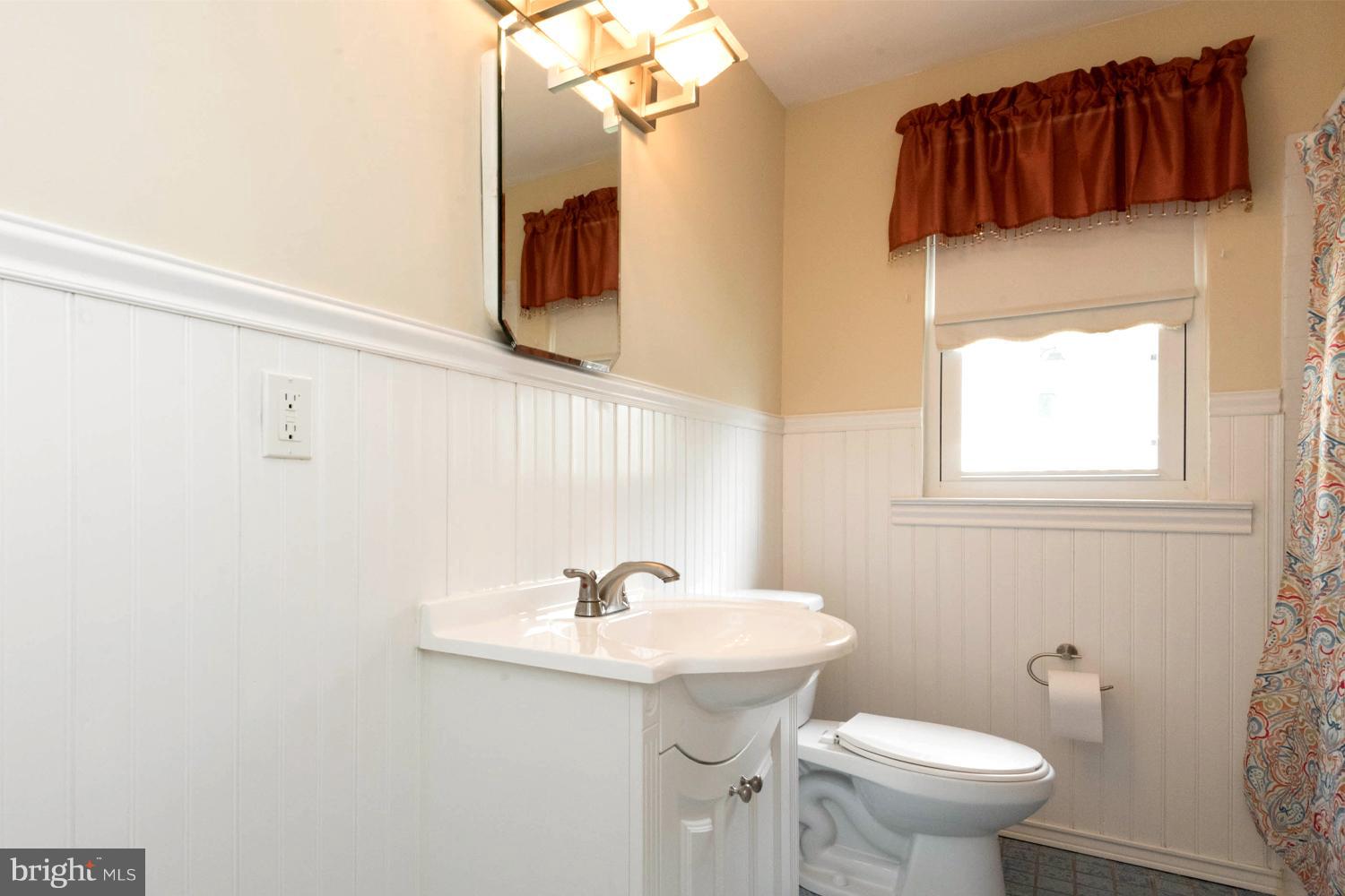259 Harlem Road Pasadena, MD 21122 - Photo 26 of 30 Attractively Appointed and Wainscoted Hall Bath