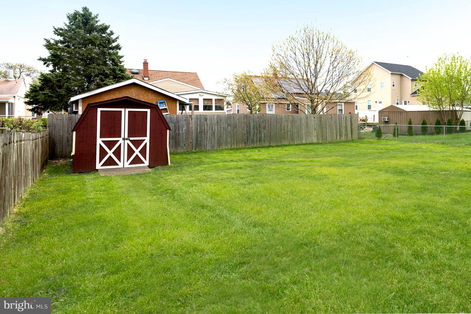 259 Harlem Road Pasadena, MD 21122 - Photo 6 of 30 Sprawling Fenced Rear Yard / Detached Storage Shed