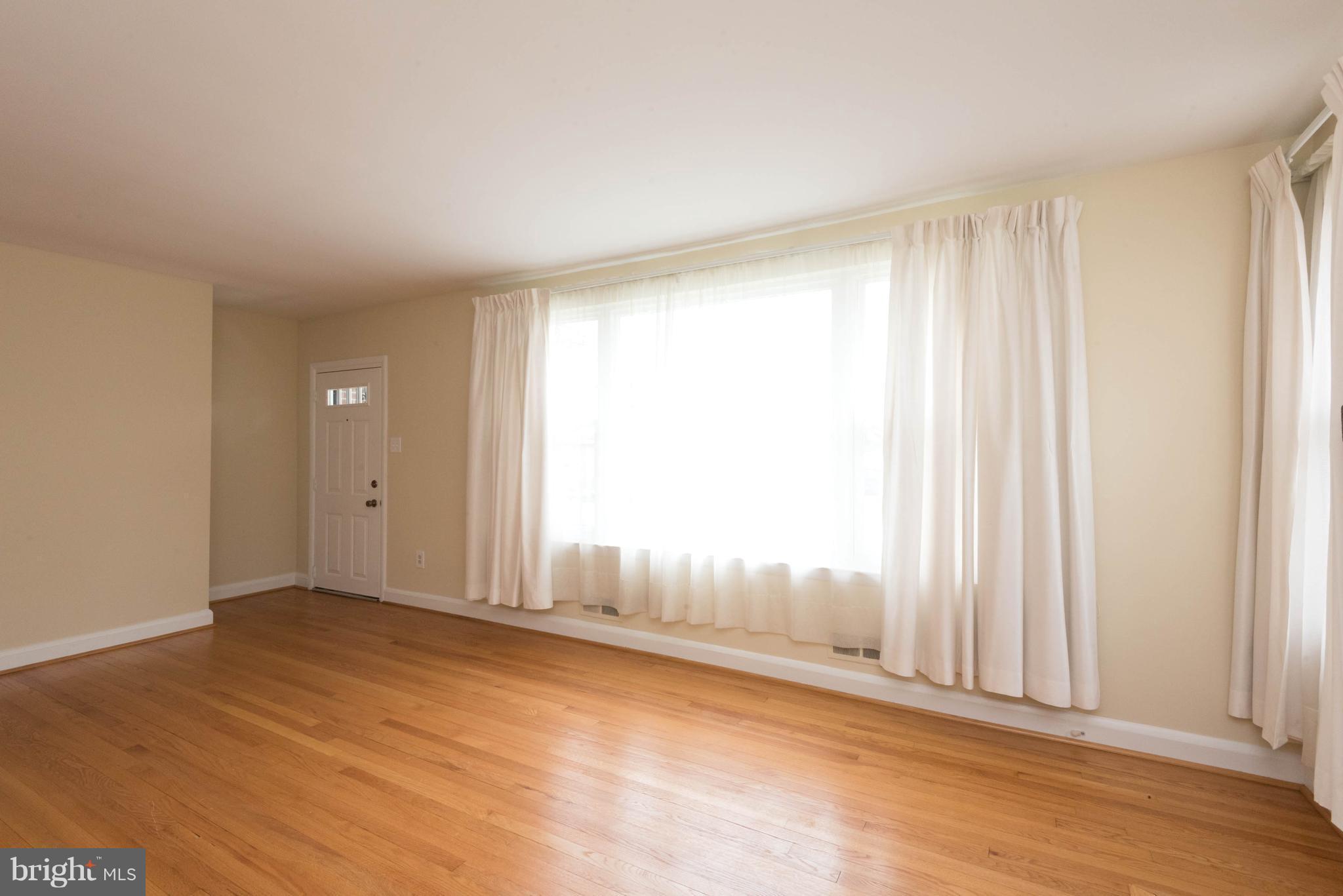 259 Harlem Road Pasadena, MD 21122 - Photo 8 of 30 Light-Filed Picture Window Living Room
