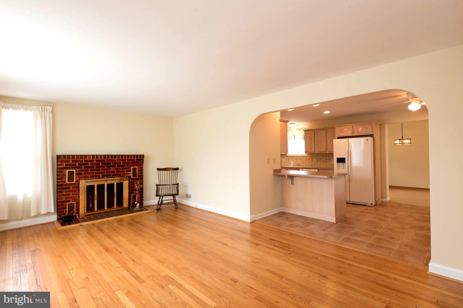 259 Harlem Road Pasadena, MD 21122 - Photo 9 of 30 Refinished Hardwood Floors/ Period Arched Doorways