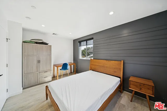 a bedroom with a bed and a closet