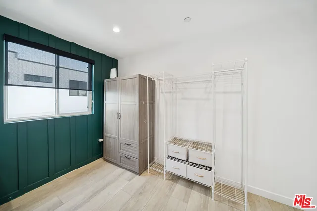 a view of an empty room and a window