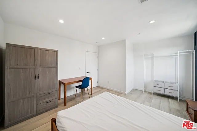 a bed room with a bed and furniture