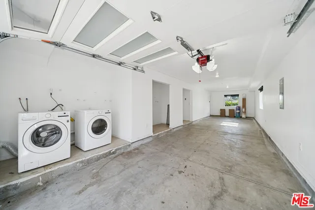 a view of a storage & utility room with washer and dryer