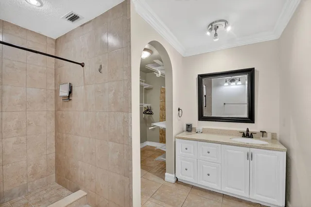 a white toilet sitting next to a bathroom sink
