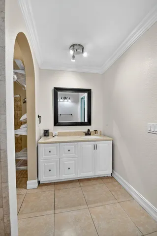 a bedroom with a bed and a bathroom