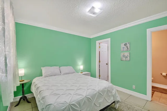 a bathroom with a sink toilet and a mirror
