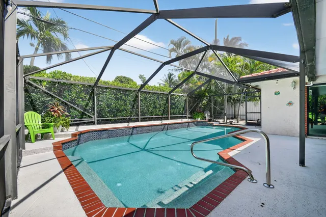 a view of a chairs and table in the balcony