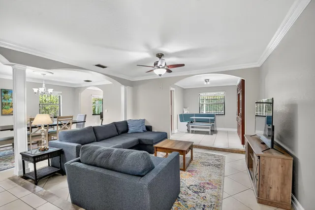 a living room with furniture and a flat screen tv