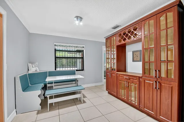 a spacious bedroom with a large bed and a large window