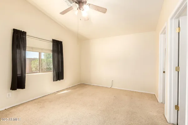 a view of an empty room with a window