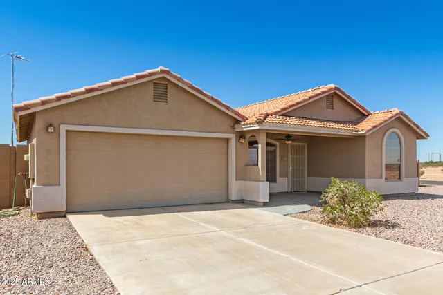 a front view of a house with a garage