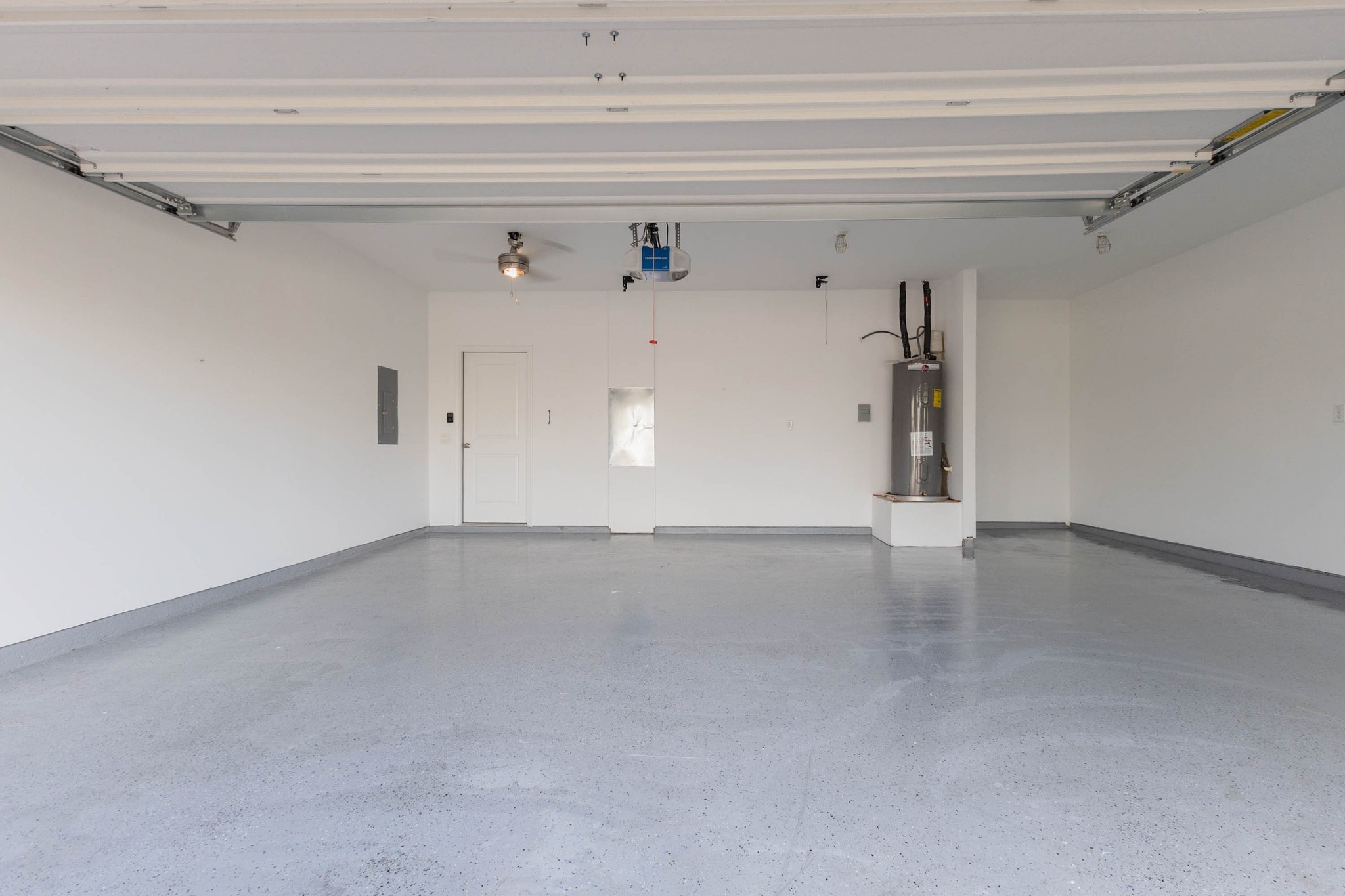 331 Seneca Loop Kyle, TX 78640 - Photo 26 of 29 The attached two car garage features a coated floor and extra room for storage.