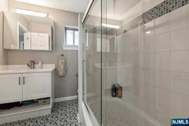 23 Asmus Road Closter, NJ 07624 - Photo 18 of 38 a bathroom with a sink and mirror