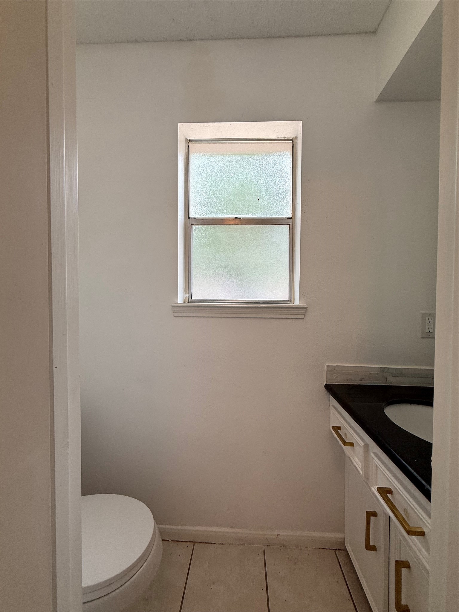 1847 Spruce Knob Drive Houston, TX 77339 - Photo 11 of 26 a bathroom with a granite countertop toilet and a sink