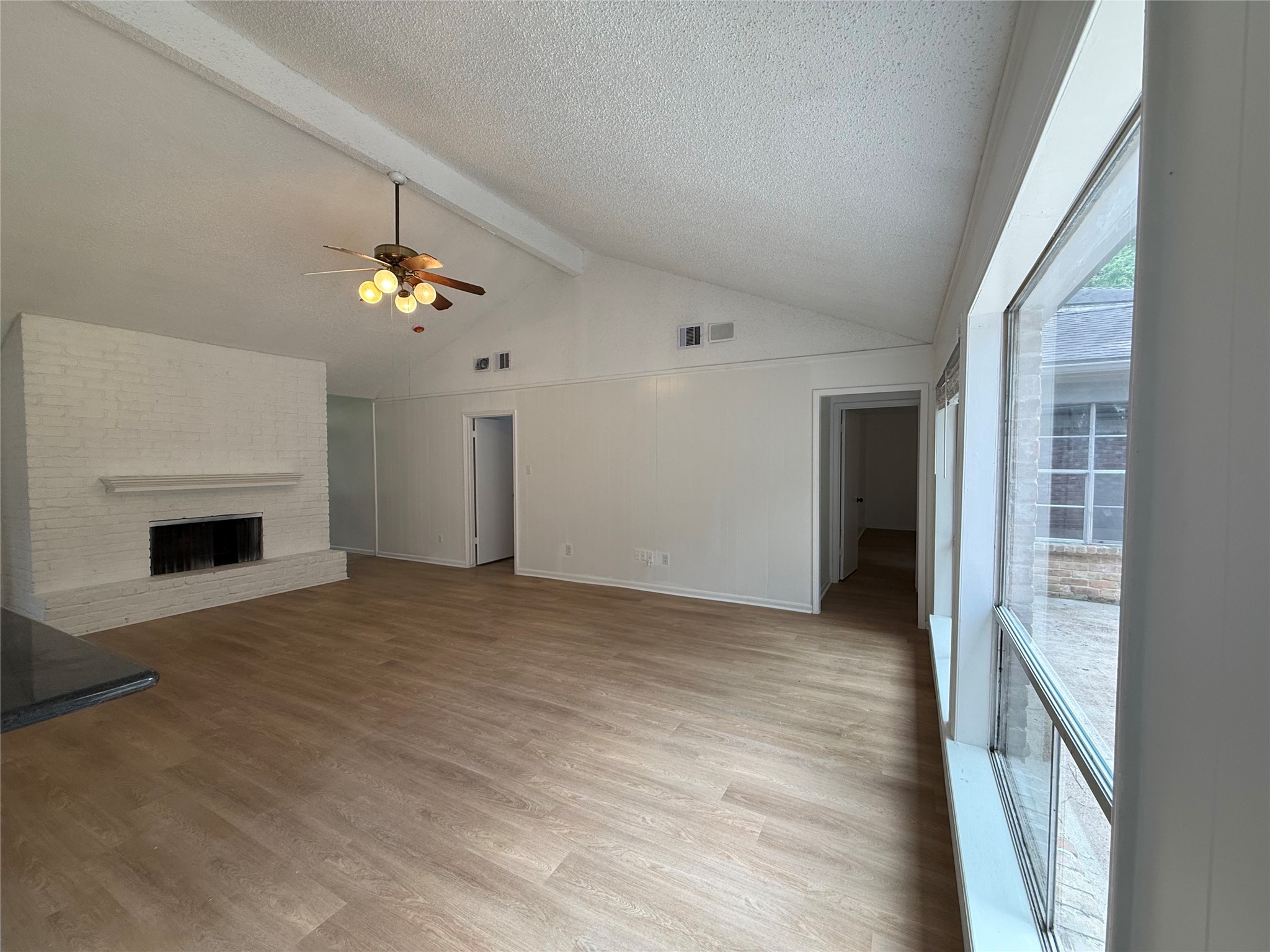 1847 Spruce Knob Drive Houston, TX 77339 - Photo 3 of 26 a view of an empty room with a fireplace and chandelier