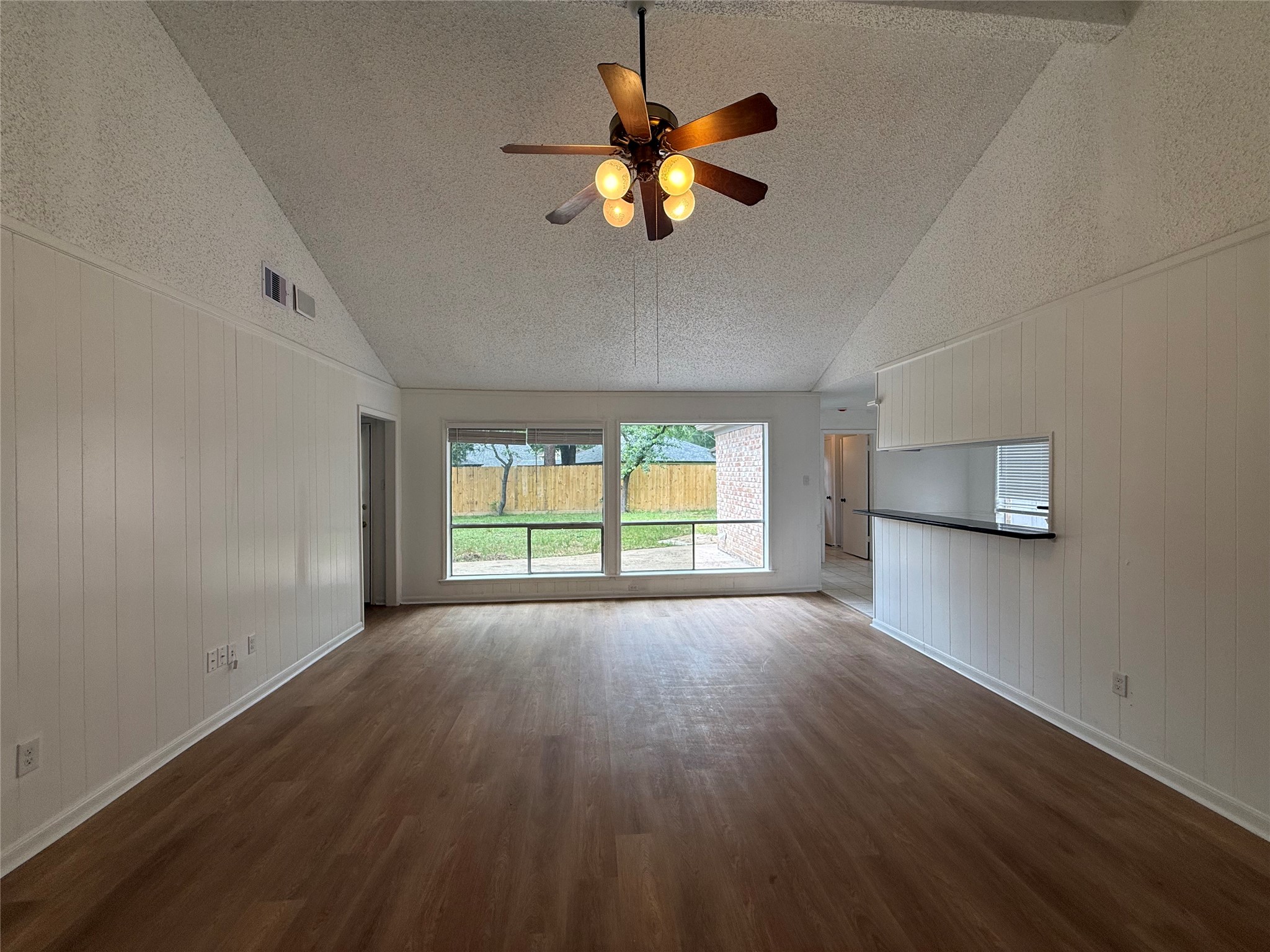 1847 Spruce Knob Drive Houston, TX 77339 - Photo 5 of 26 a view of an empty room with wooden floor and a window